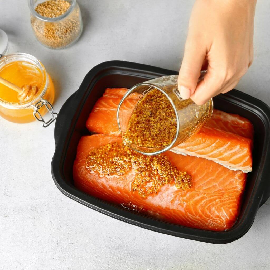 Honey-Glazed Salmon, a beautifully seared fillet with a glossy honey glaze and a sprinkle of fresh herbs.