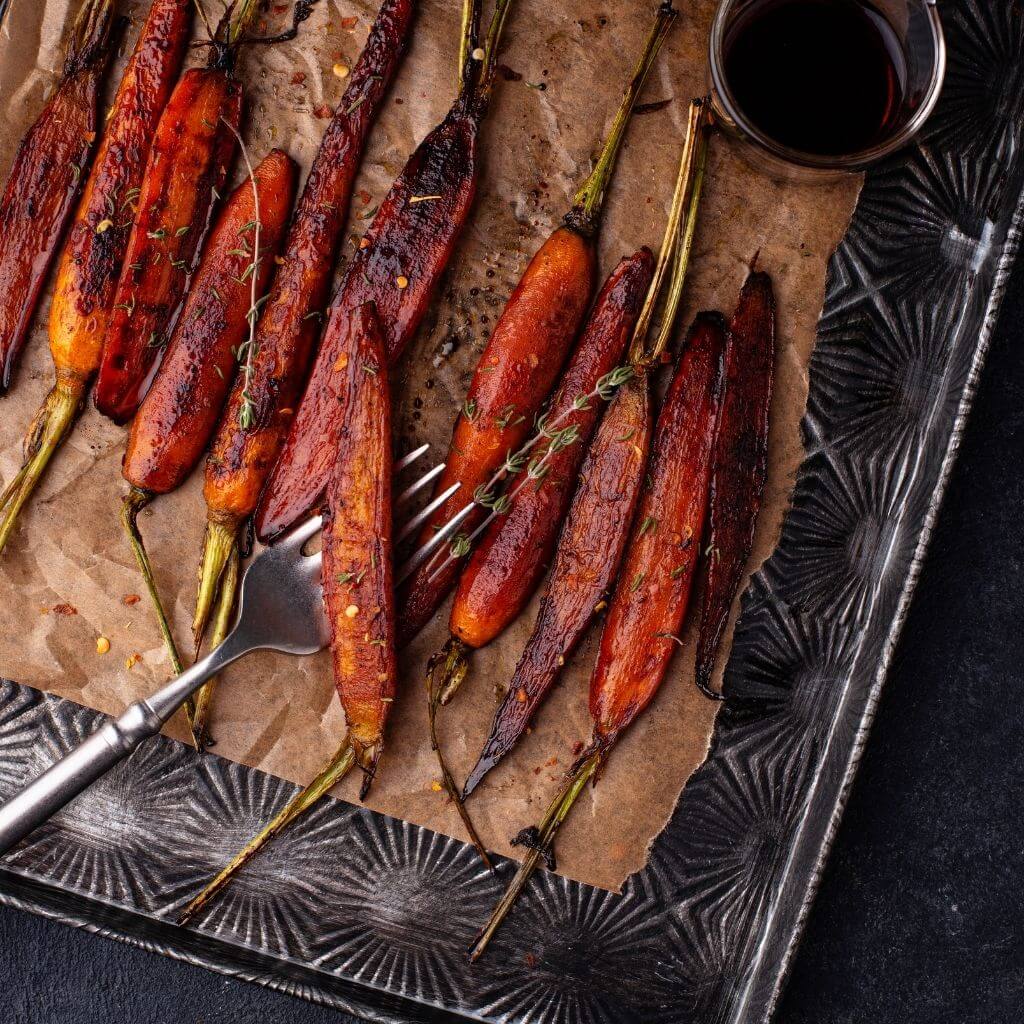 Honey-Glazed Carrots, tender carrot sticks with a luscious honey glaze, garnished with fresh parsley