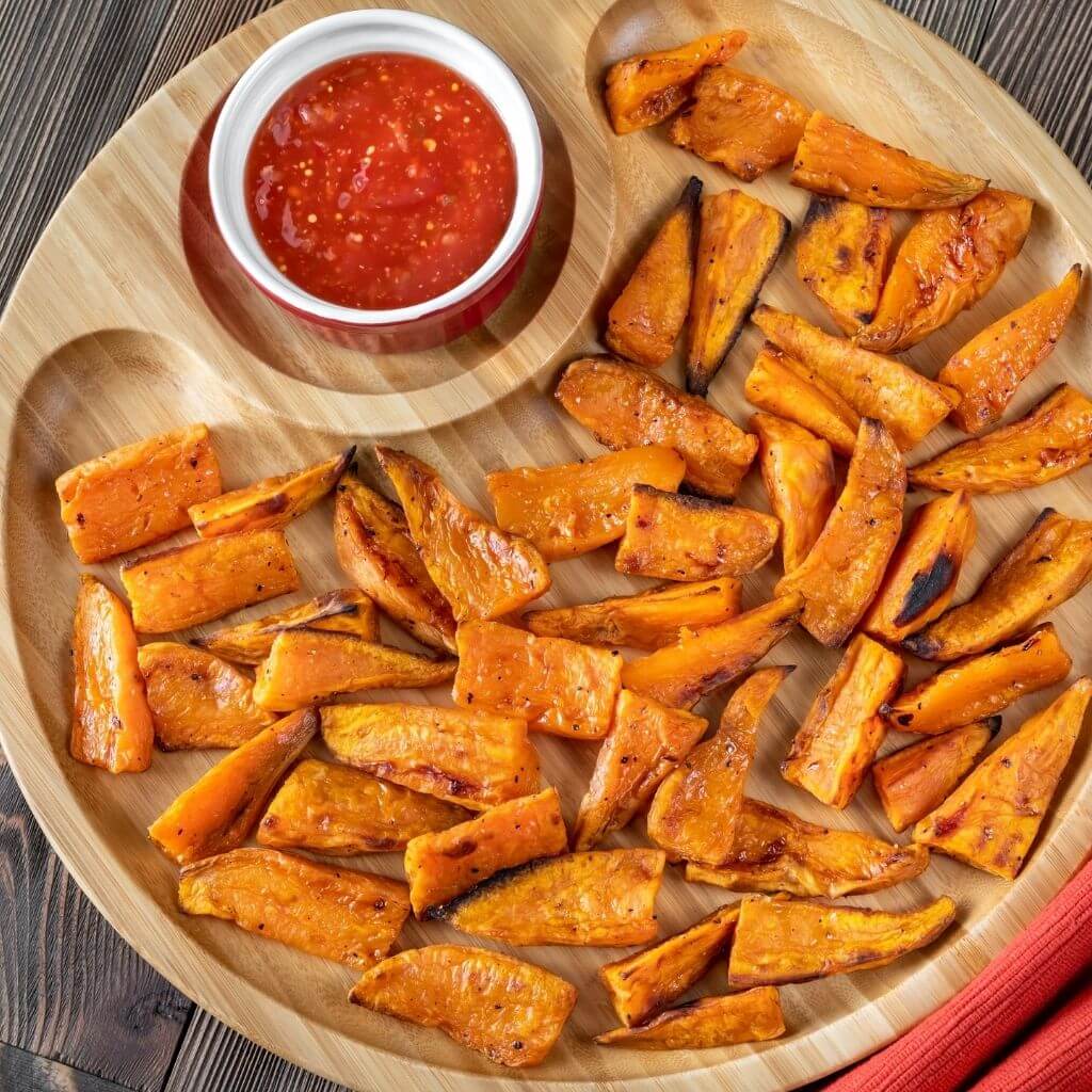 Honey-Glazed Sweet Potatoes, a delectable dish with sweet potato cubes and a rich honey glaze, topped with toasted pecans.
