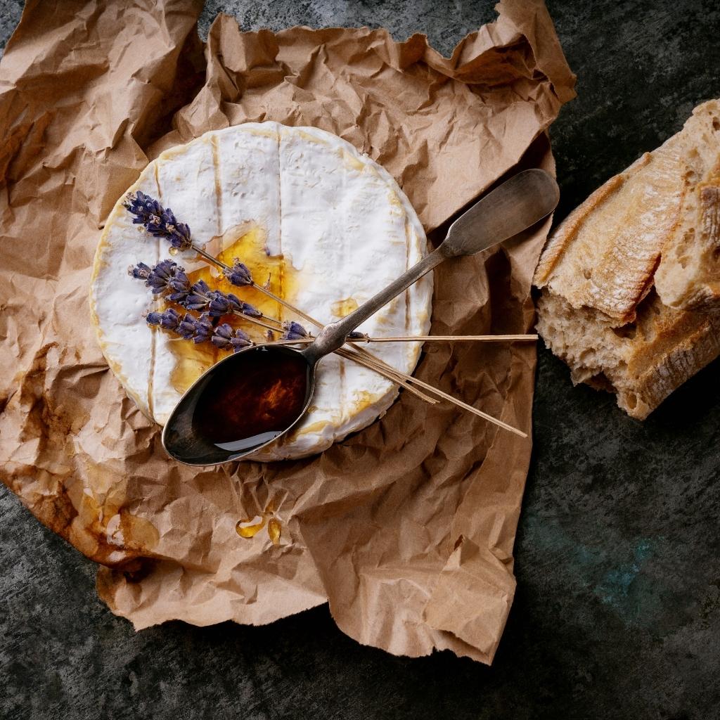 Irish Honey and Oatmeal Breaded Camembert cheese, served with a drizzle of honey and a sprinkle of oats.