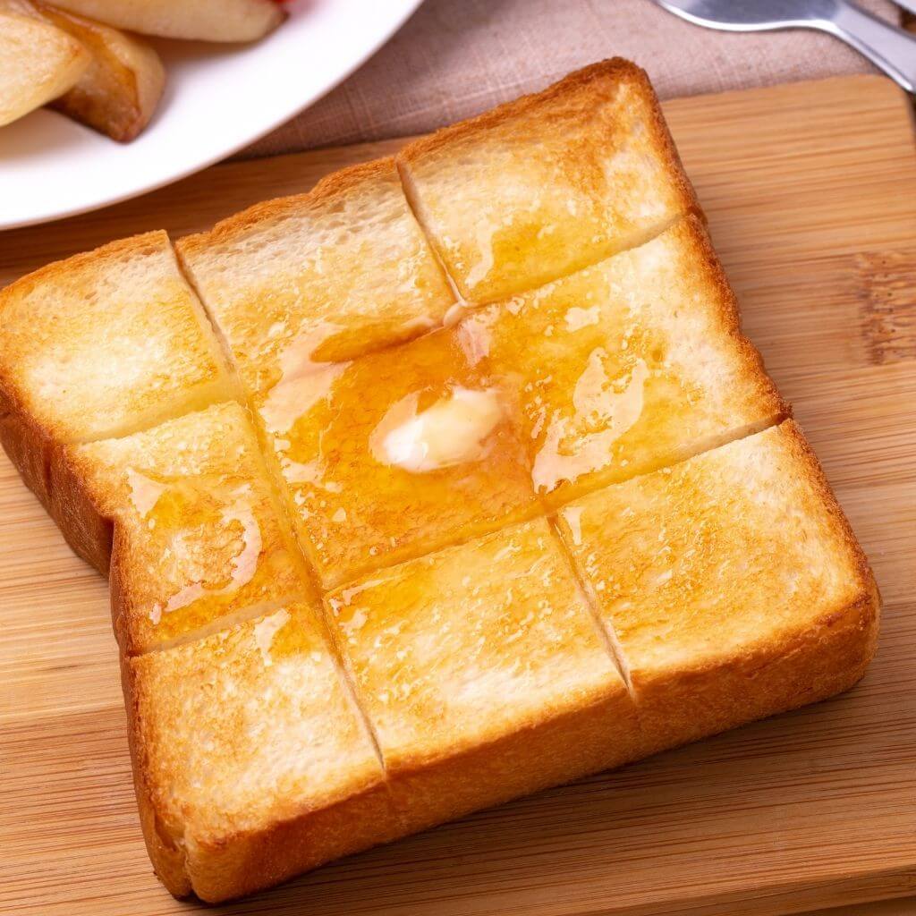 Sliced Irish Honey Butter Toast with a generous spread of honey-infused butter.