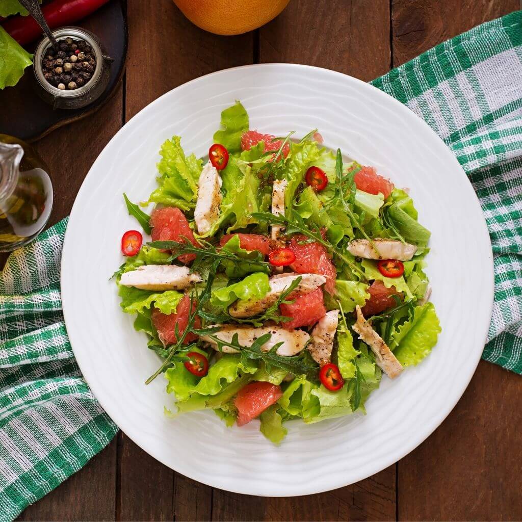 Honey Mustard Chicken Salad, a vibrant salad with grilled chicken, mixed greens, cherry tomatoes, and a honey mustard dressing.