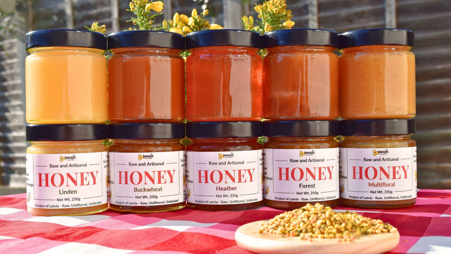 Five jars of artisanal raw honey, including Forest, Buckwheat, Linden, and Multifloral varieties, showcasing the labels and the honey's natural richness.